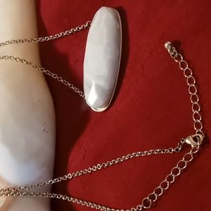 White onyx bar necklace on 22+2 inch long rolo gold tone chain.
